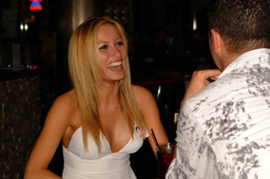 Woman laughing during a speed date